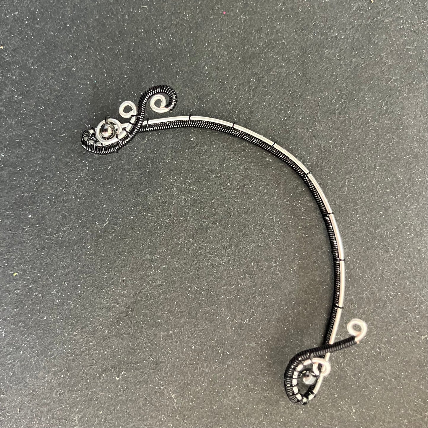 Silver plated black ear wrap with metal beads