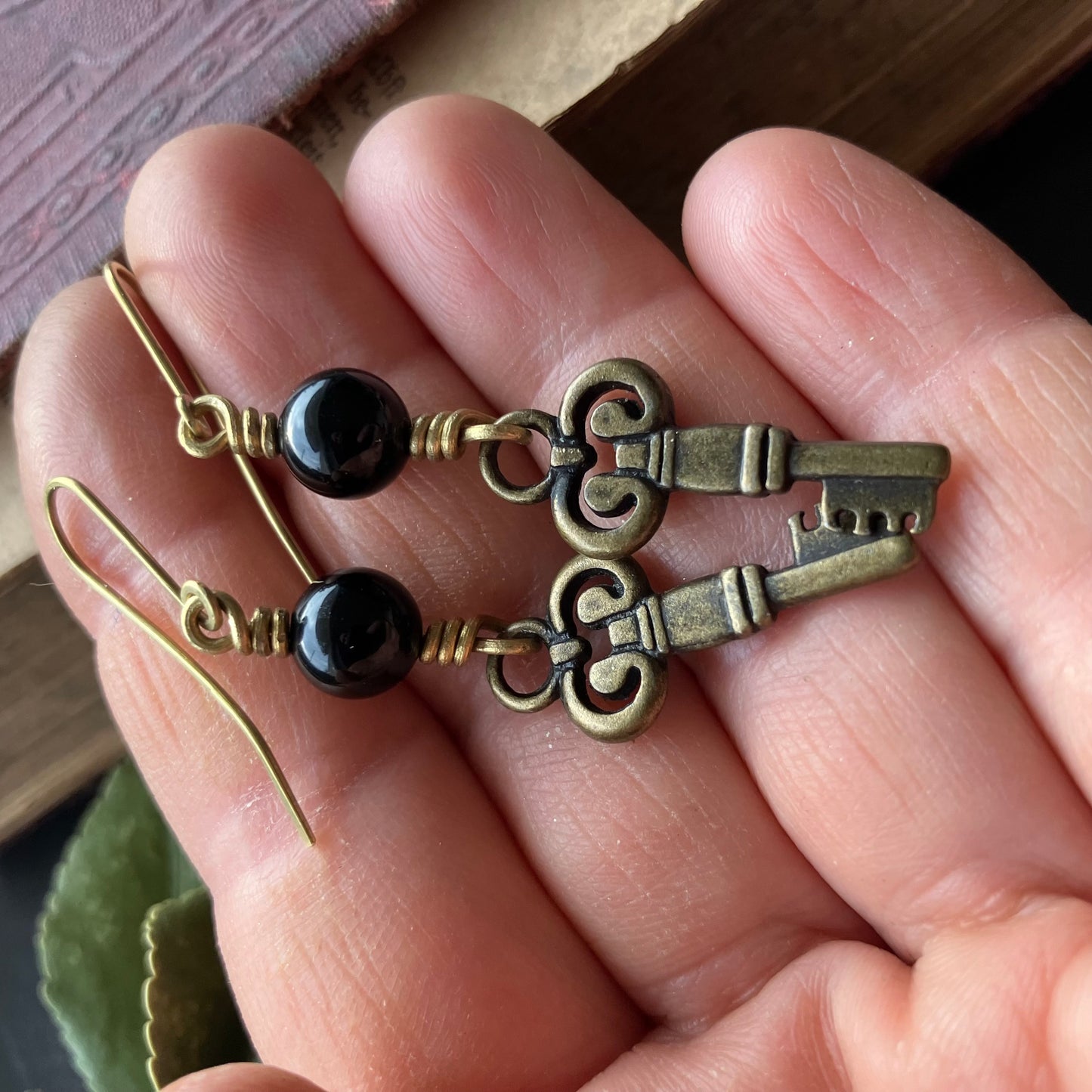 Brass key earrings with onyx