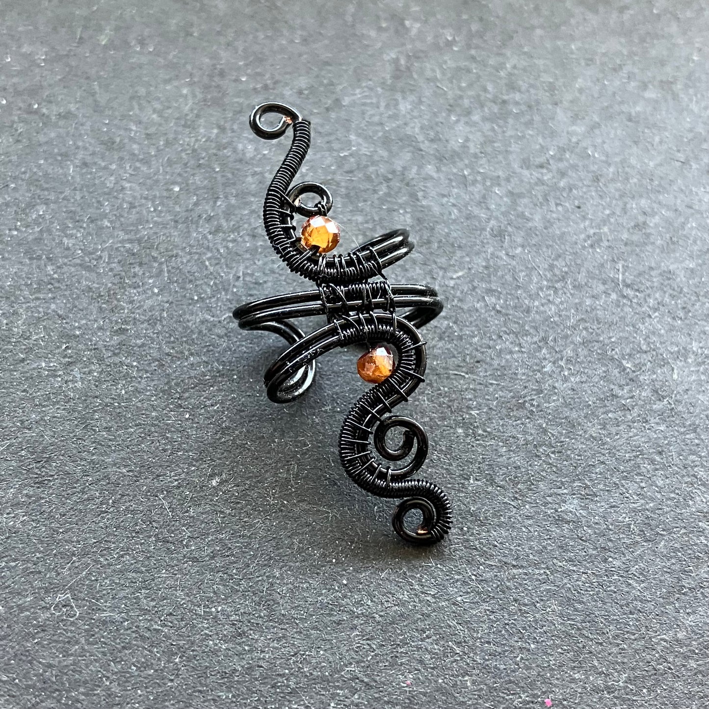 Phoenix black and hessonite ear cuff