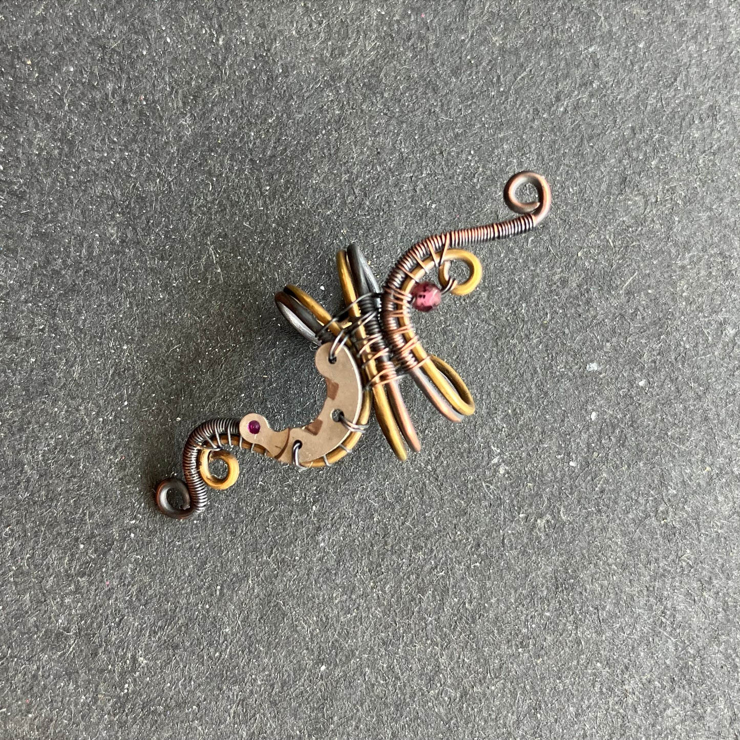 steampunk wire wrapped ear cuff with garnet