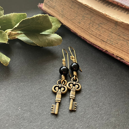 Brass key dangle earrings with onyx
