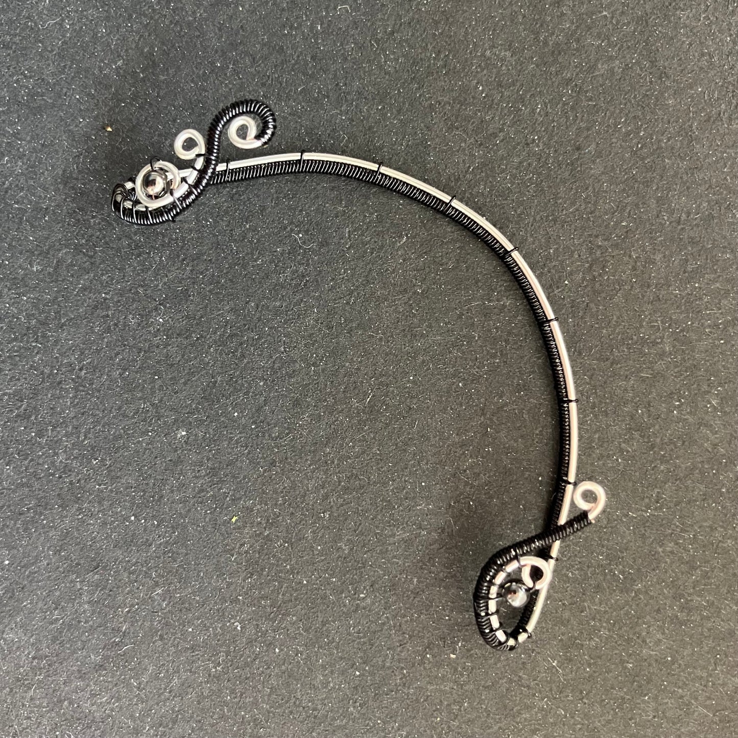 Silver plated black ear wrap with metal beads