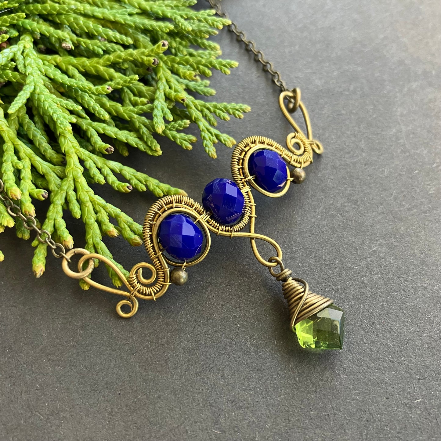 copper wire wrapped necklace with wide pendant blue and green beads