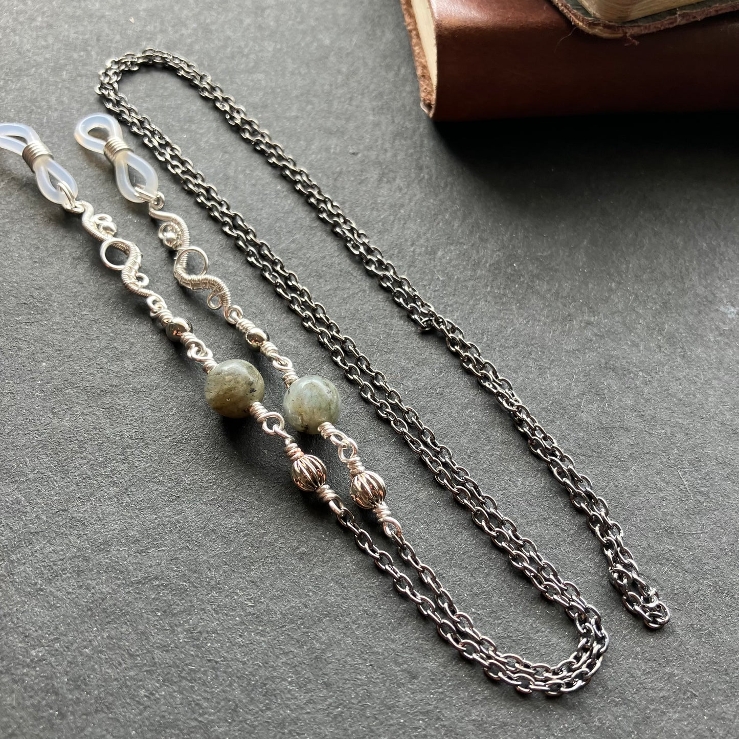 A silver-plated eyeglass chain with beads of labradorite