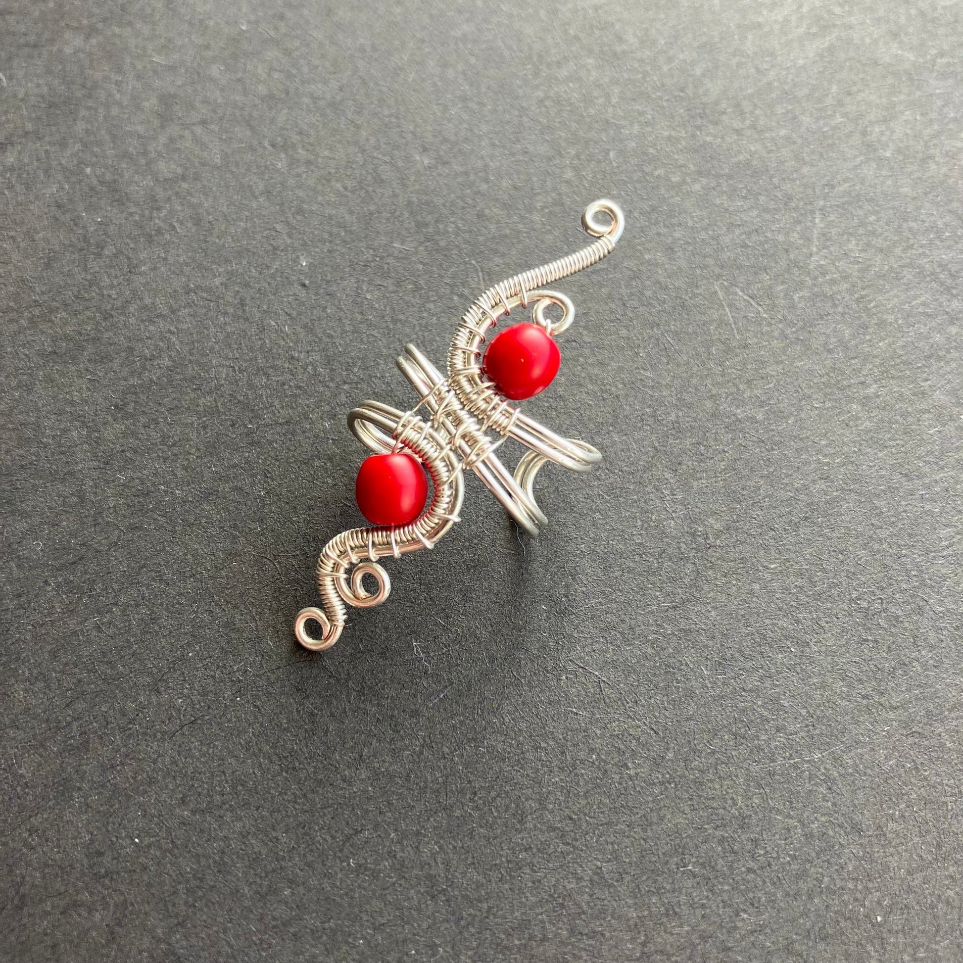 silver and red ear cuff