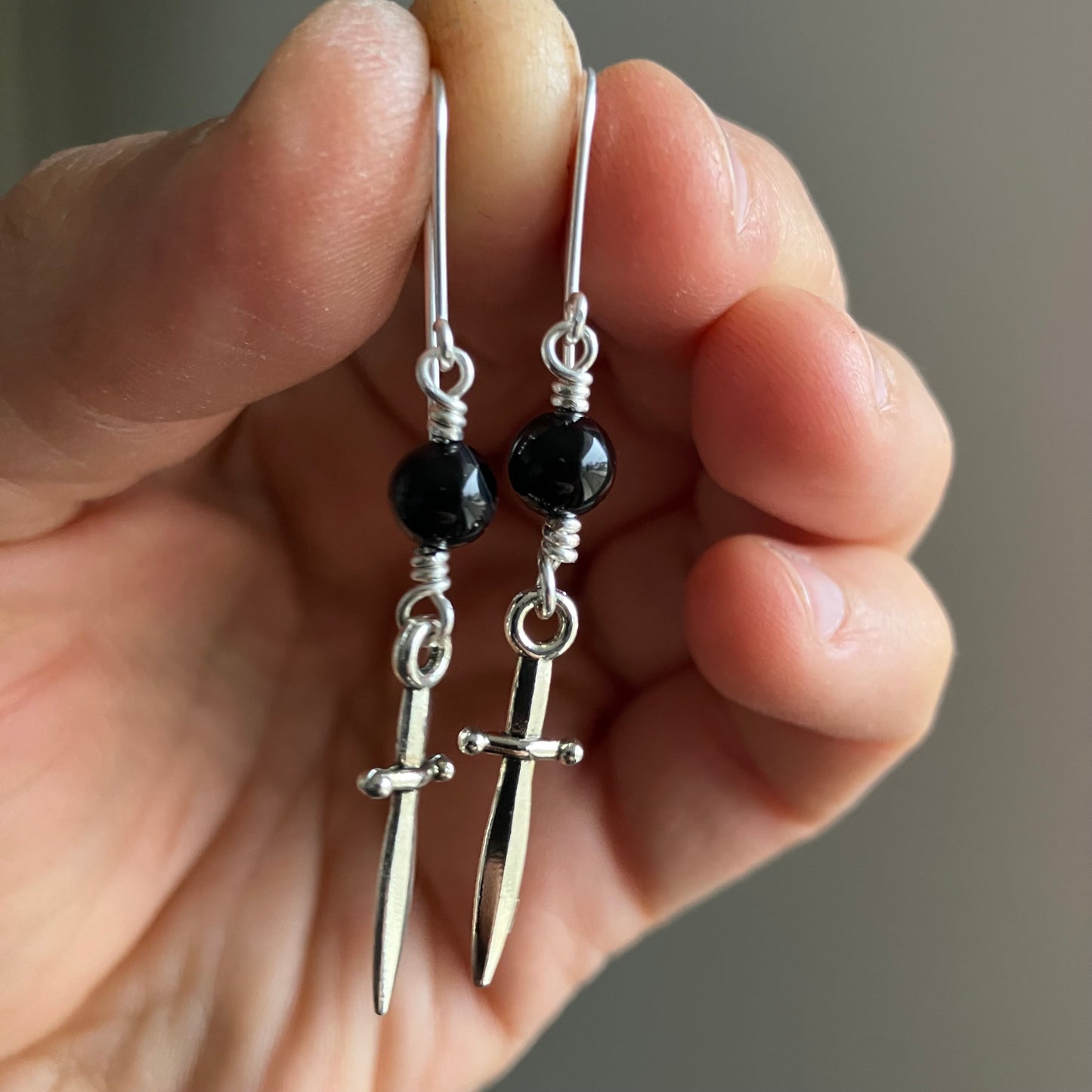 Silverplated sword earrings with onyx