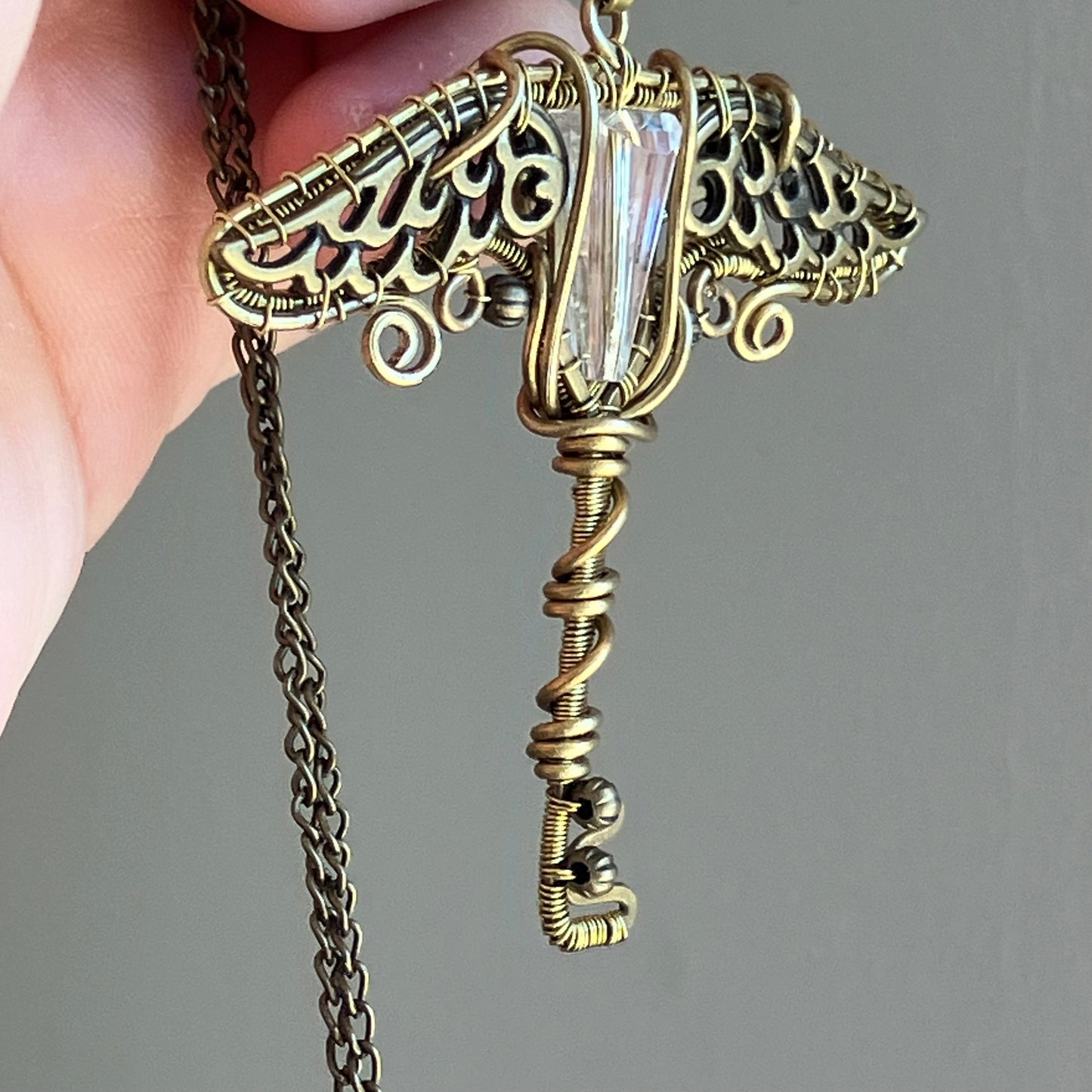 Last of Glass - brass clear winged key pendant