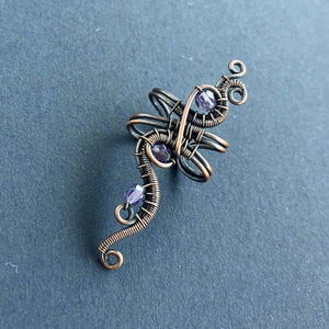 wire wrapped copper ear cuff with traslucent purple beads
