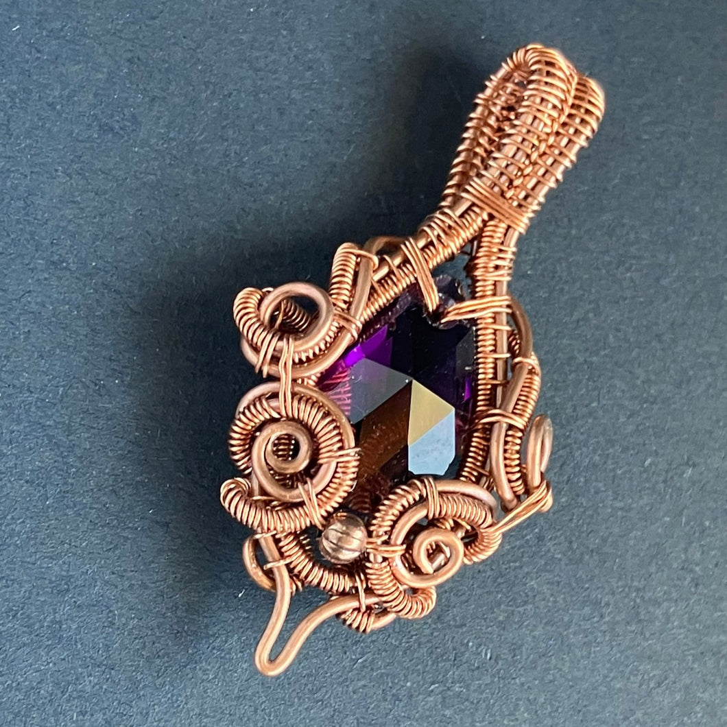 wire wrapped copper pendant with purple stone