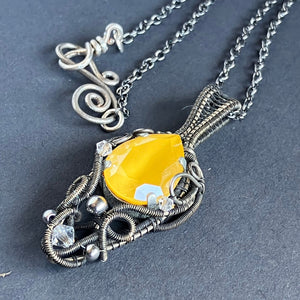 silver wire wrapped necklace with yellow glass stone