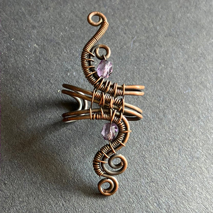 copper wire wrapped ear cuff with translucent pale purple beads 