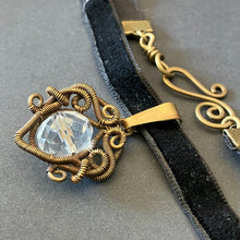 Load image into Gallery viewer, brass wire wrapped pendant with clear glass bead on black velvet choker
