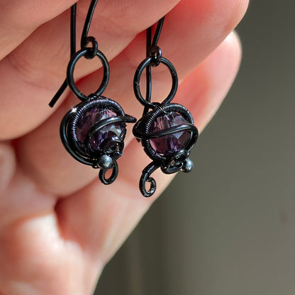 Black and purple earrings
