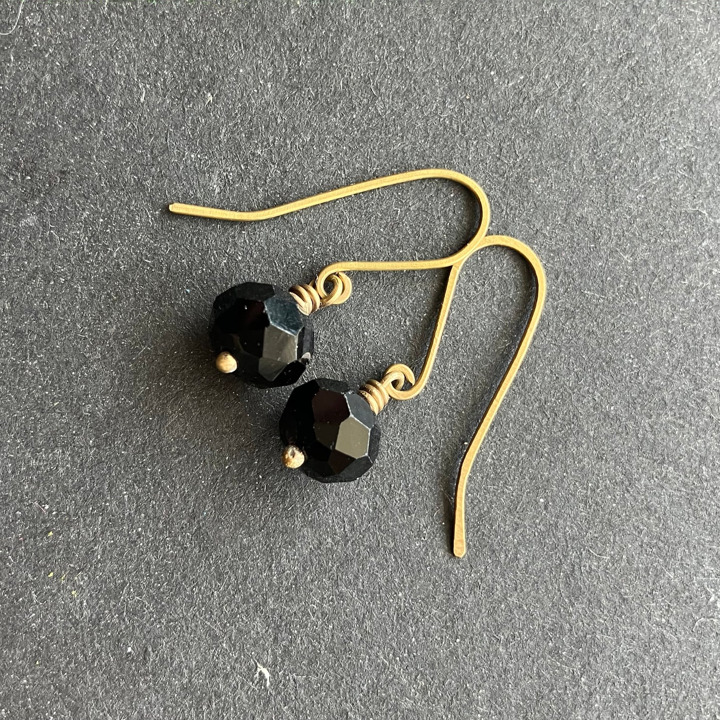 Short brass and black earring