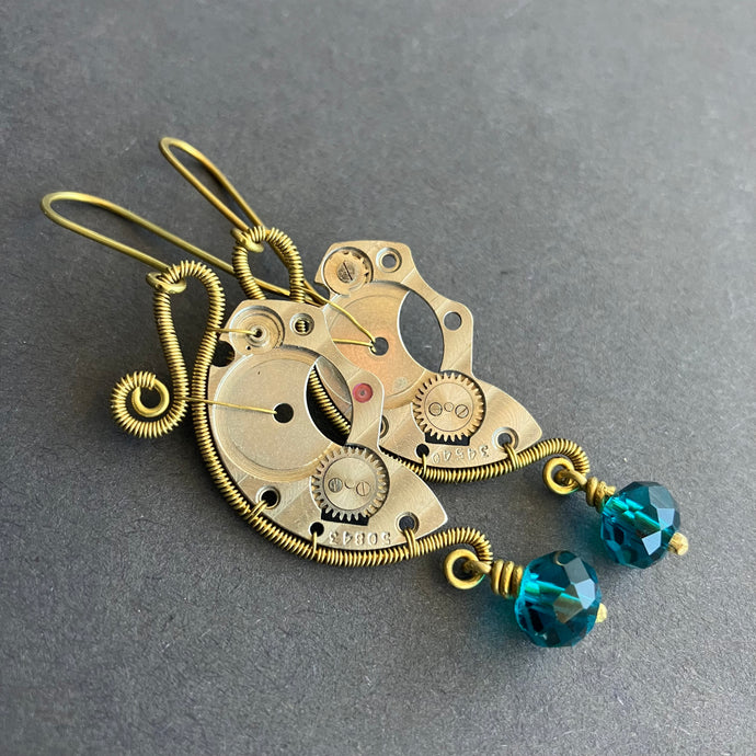 steampunk earrings with clockwork parts and translucent blue beads