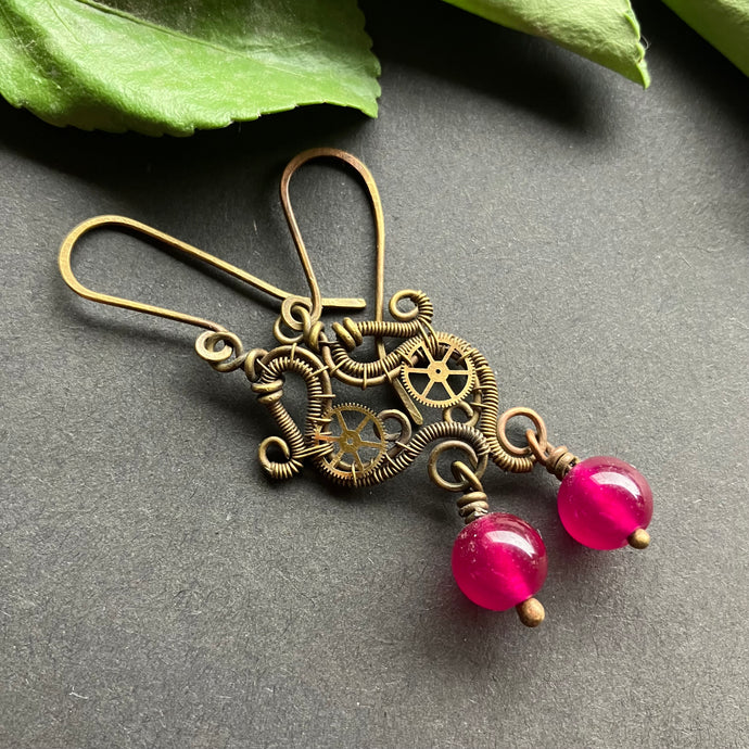 brass wire wrapped dangle earrings with gears and hot pink beads 