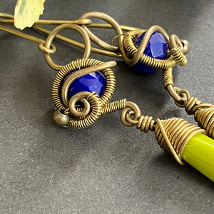 brass wire wrapped dangle earring with blue and green beads