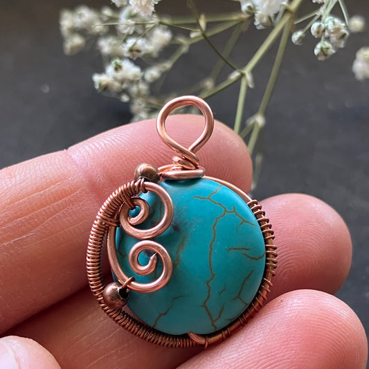 Turquoise stone with copper wire wrapping