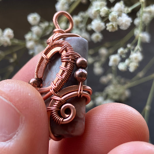 copper wire-wrapped pendant with gemstone
