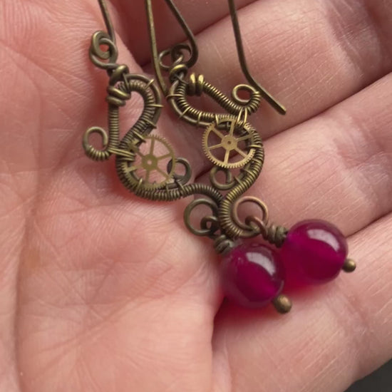 brass wire wrapped dangle earrings with gears and hot pink beads 