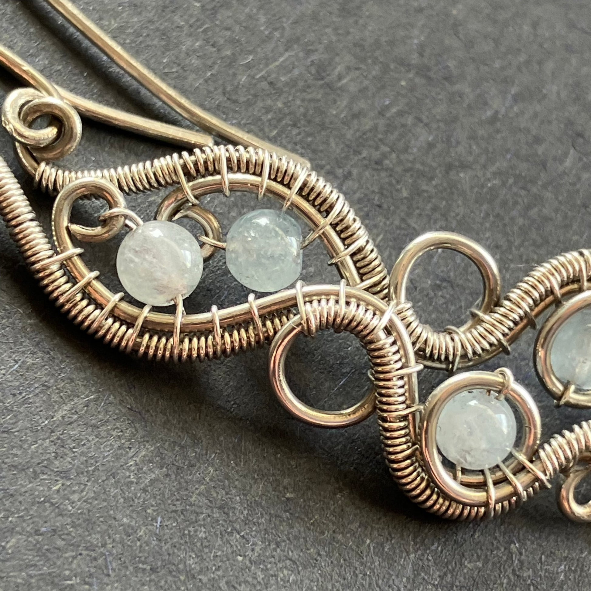 sterling silver earrings with wire wrapping and aquamarine beads.