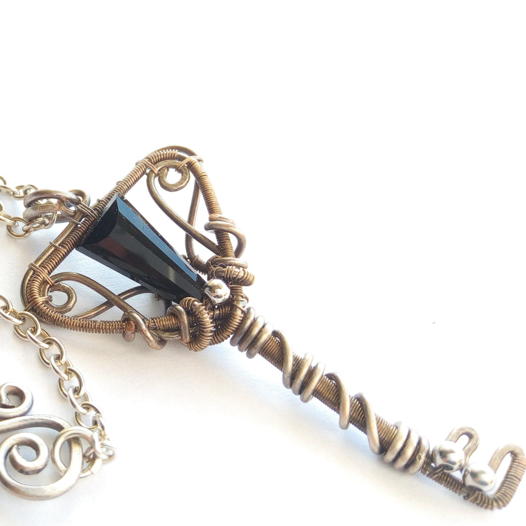 gothic silver color wire wrapped key shaped pendant with black glass bead