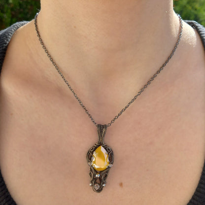 silver wire wrapped necklace with yellow glass stone