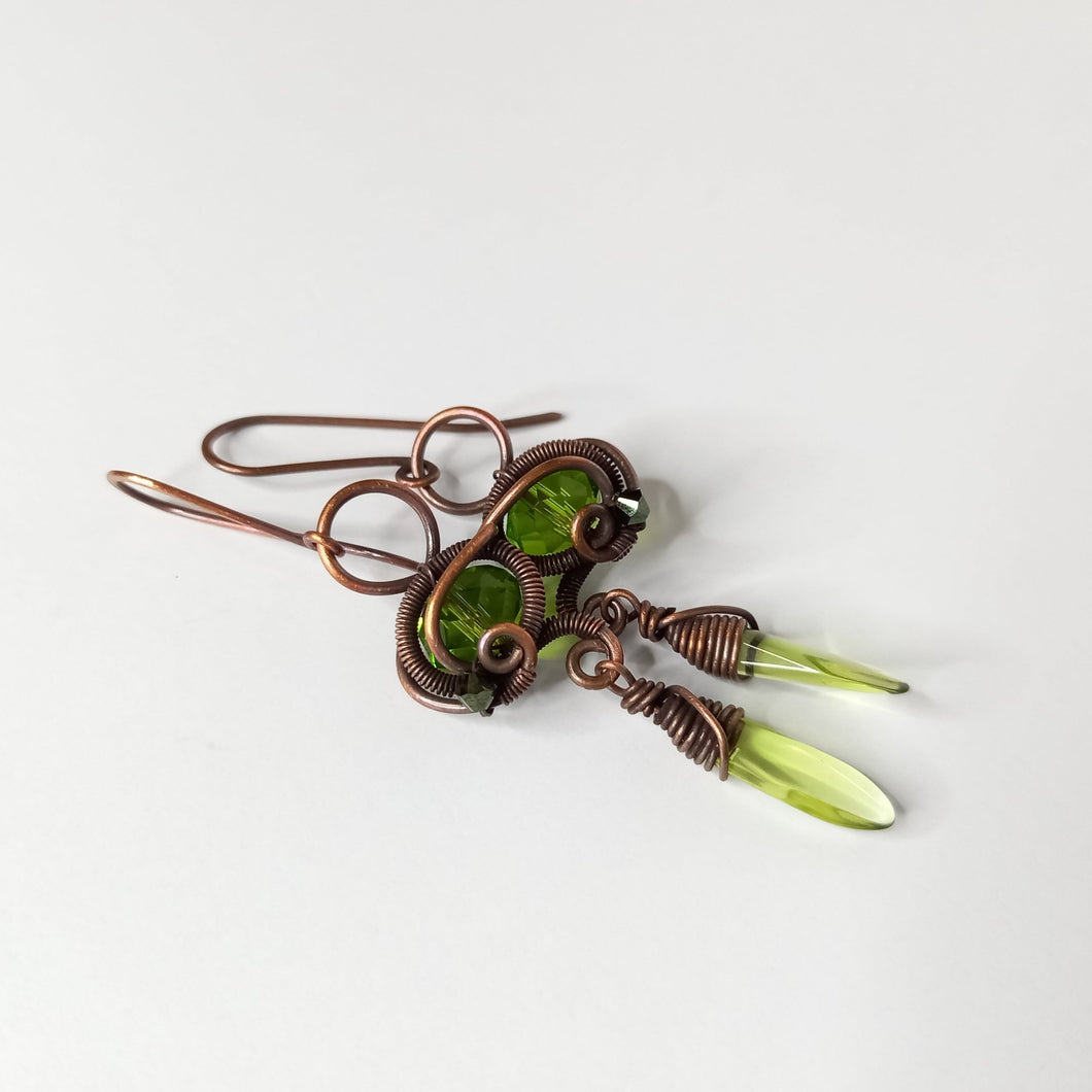 goblincore copper wire wrapped dangle earrings with green beads 