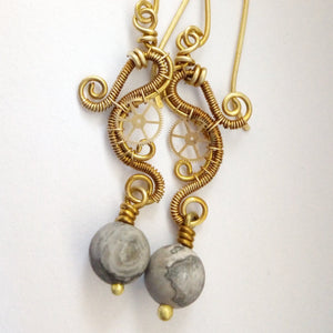 brass wire wrapped dangle earrings with gears and grey jasper beads