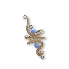 Load image into Gallery viewer, wire wrapped silver ear cuff with light blue beads
